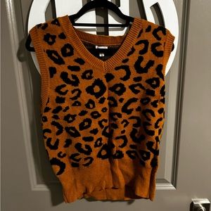 Leopard print sweater vest. New with tags. Size Large